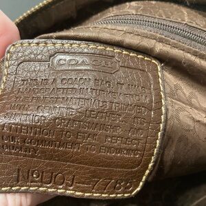 Coach Brown Leather Backpack with Timeless Charm